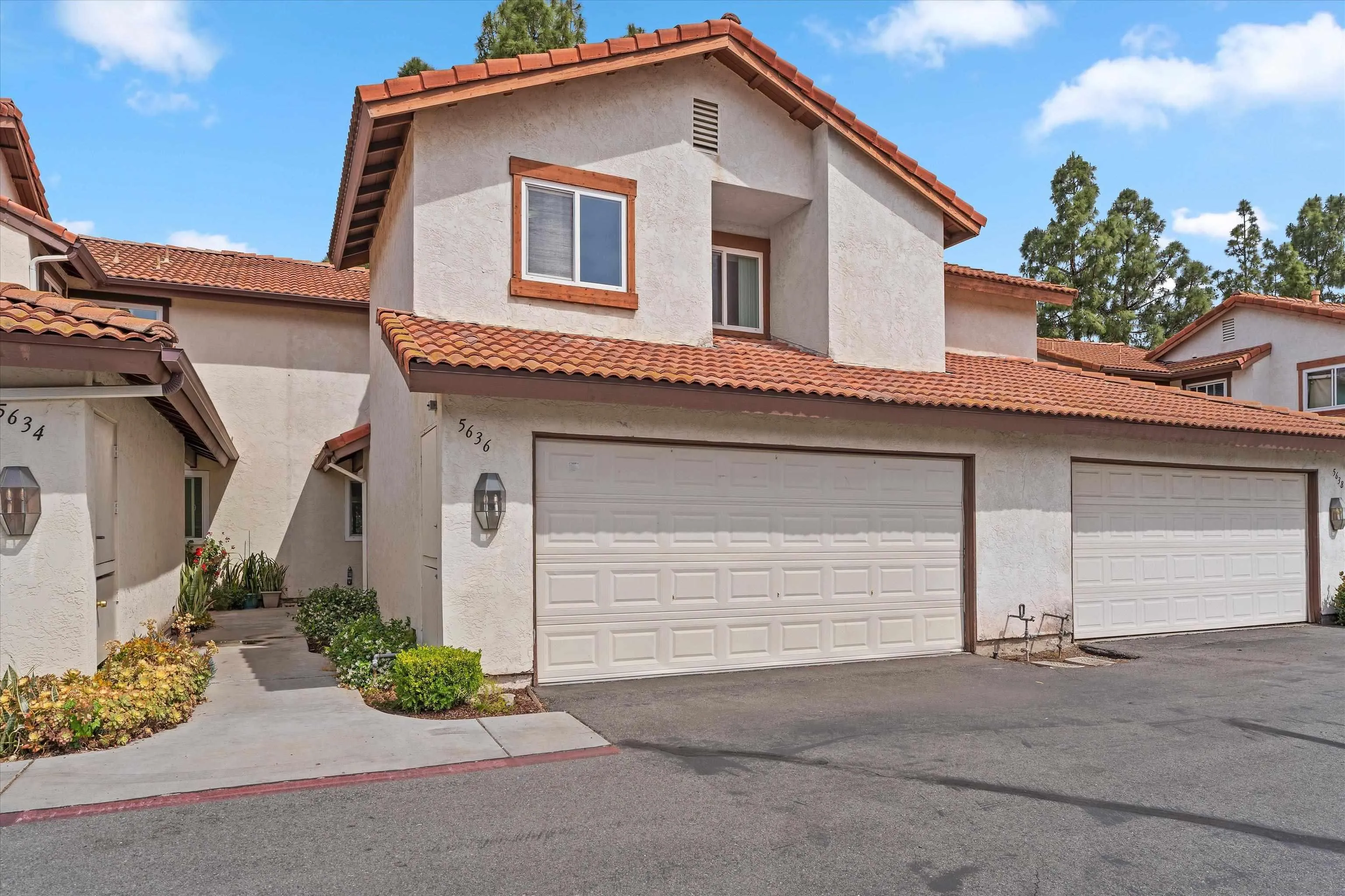 5636 Boot Way Oceanside, CA 92057 - Photo 1 of 36 a white house with a small yard and parking space
