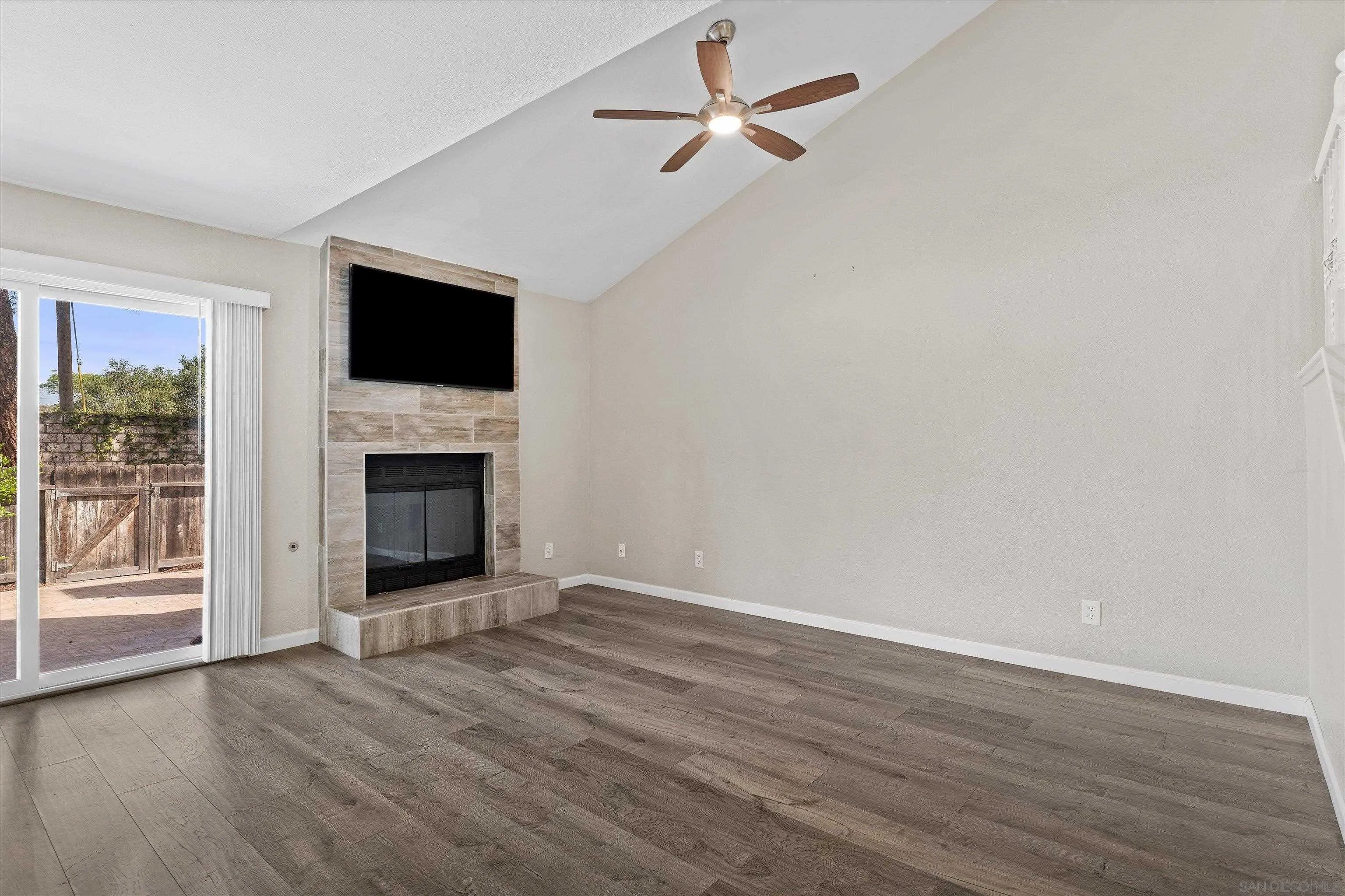 5636 Boot Way Oceanside, CA 92057 - Photo 13 of 36 a view of empty room with wooden floor and fireplace