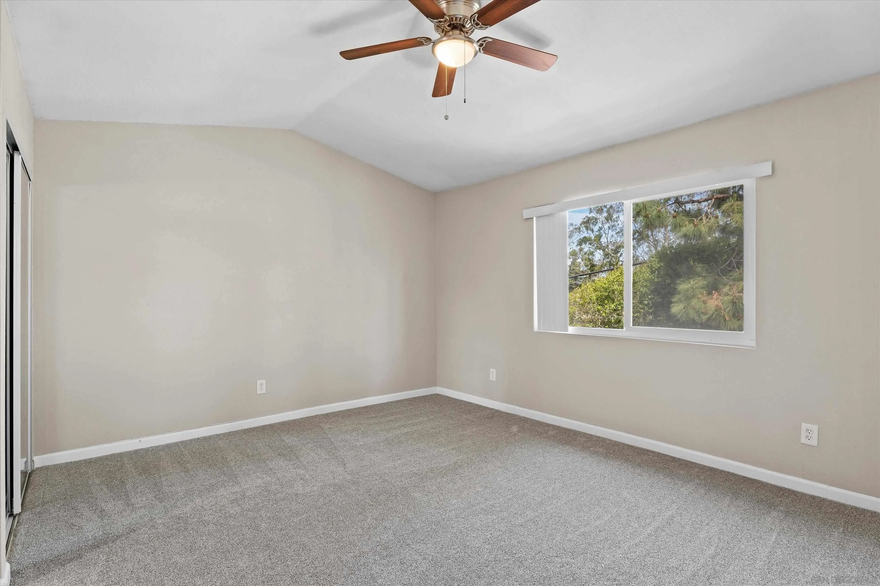 5636 Boot Way Oceanside, CA 92057 - Photo 16 of 36 an empty room with window and ceiling fan