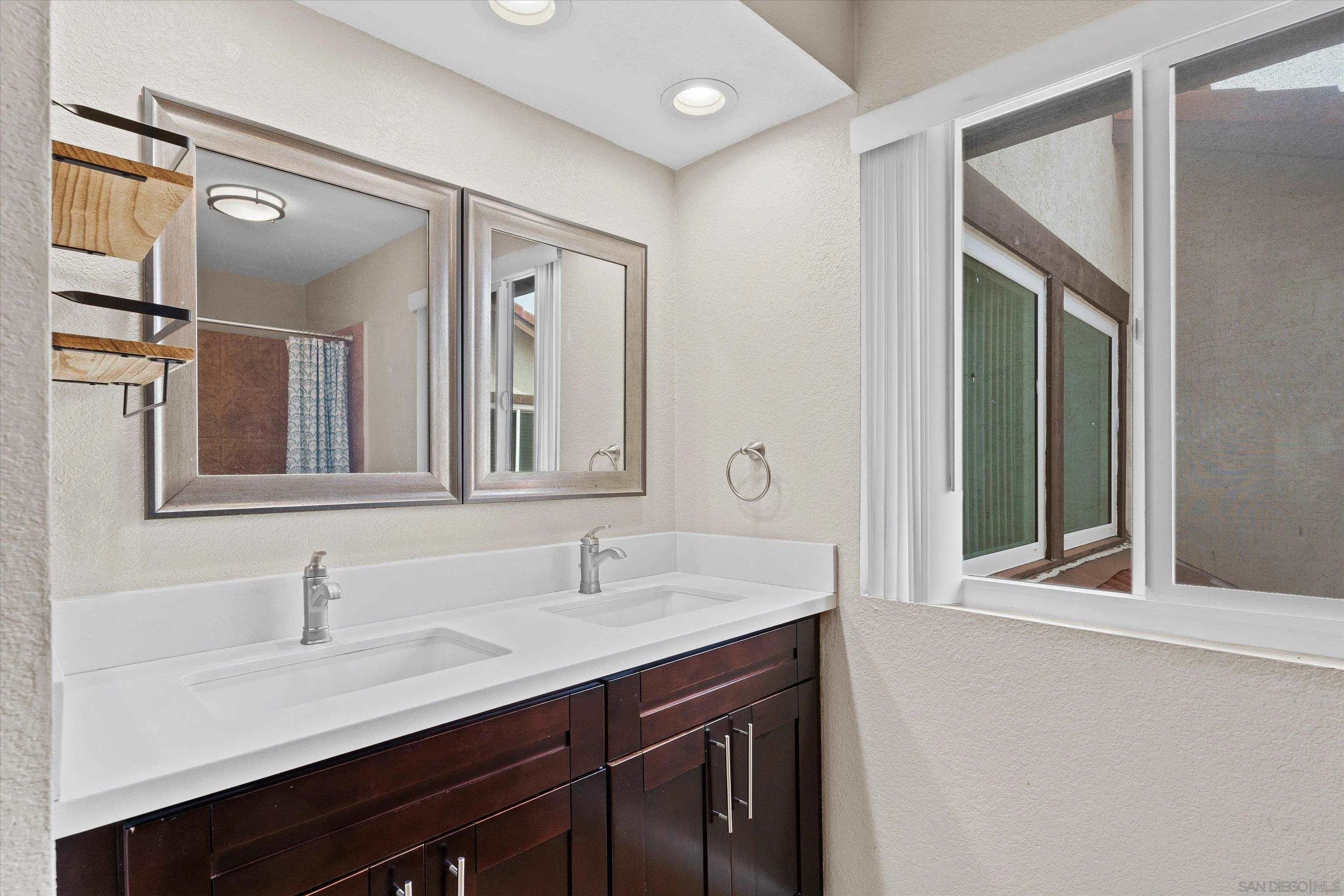 5636 Boot Way Oceanside, CA 92057 - Photo 18 of 36 a bathroom with a sink and a mirror