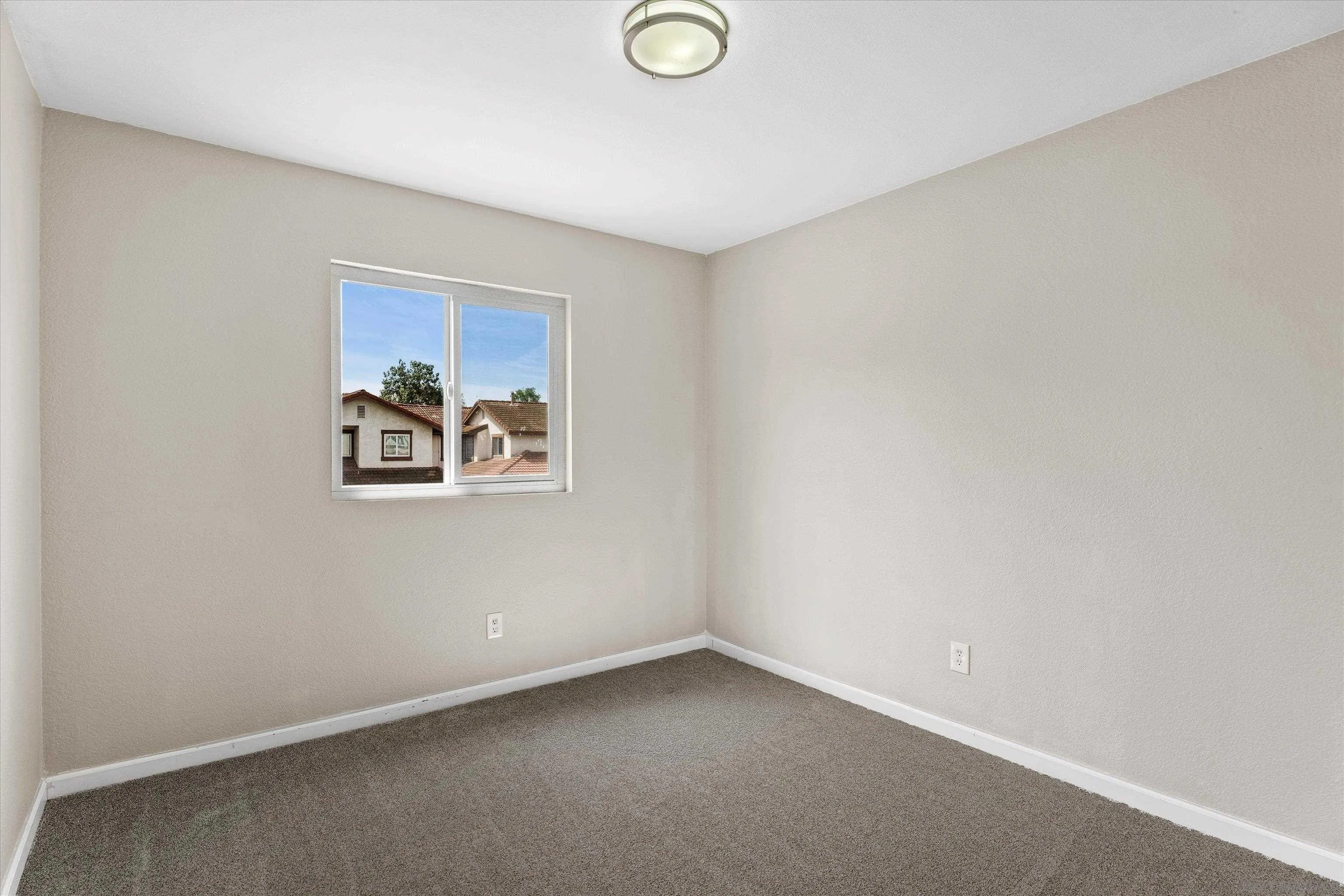 5636 Boot Way Oceanside, CA 92057 - Photo 20 of 36 an empty room with windows