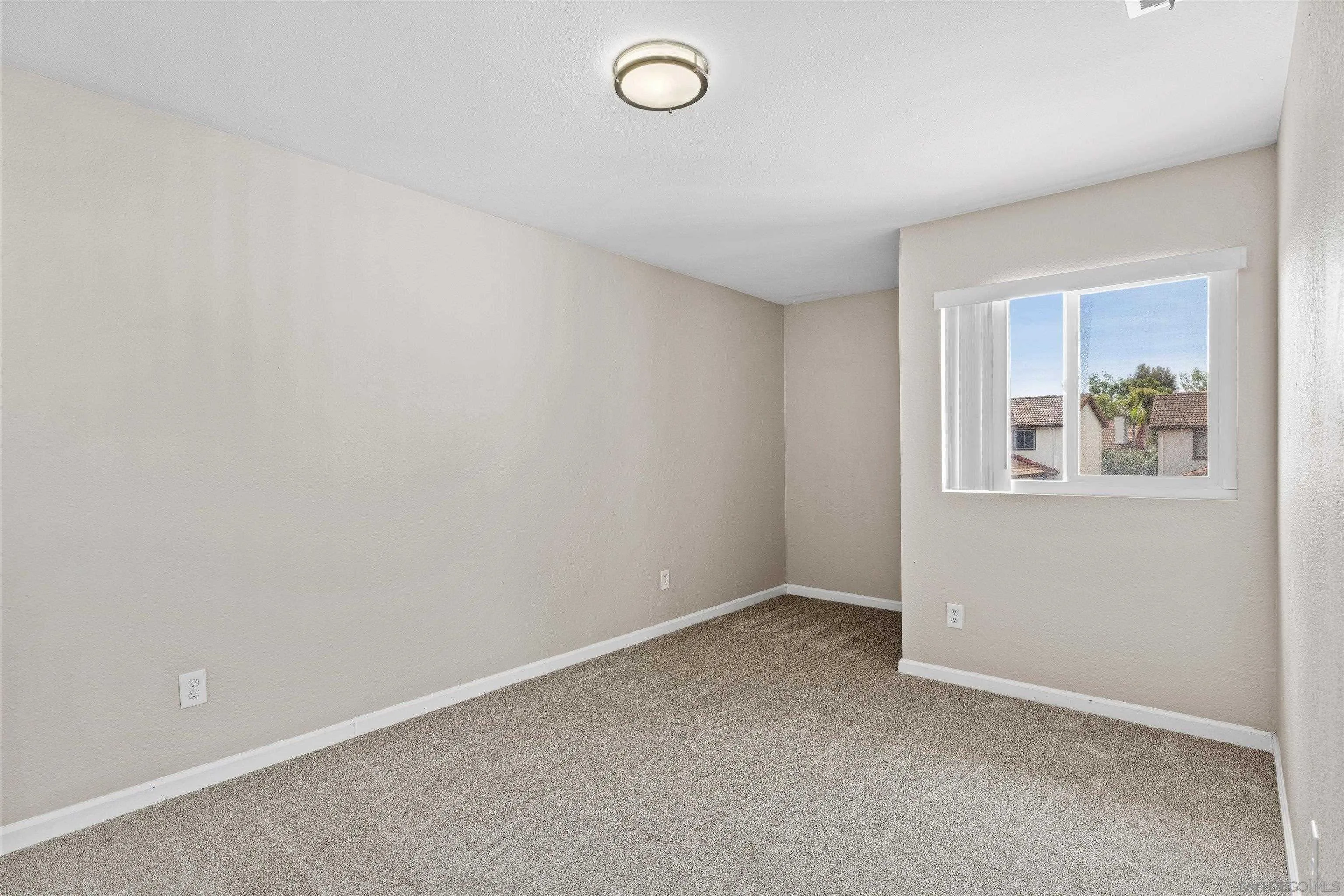5636 Boot Way Oceanside, CA 92057 - Photo 23 of 36 an empty room with windows