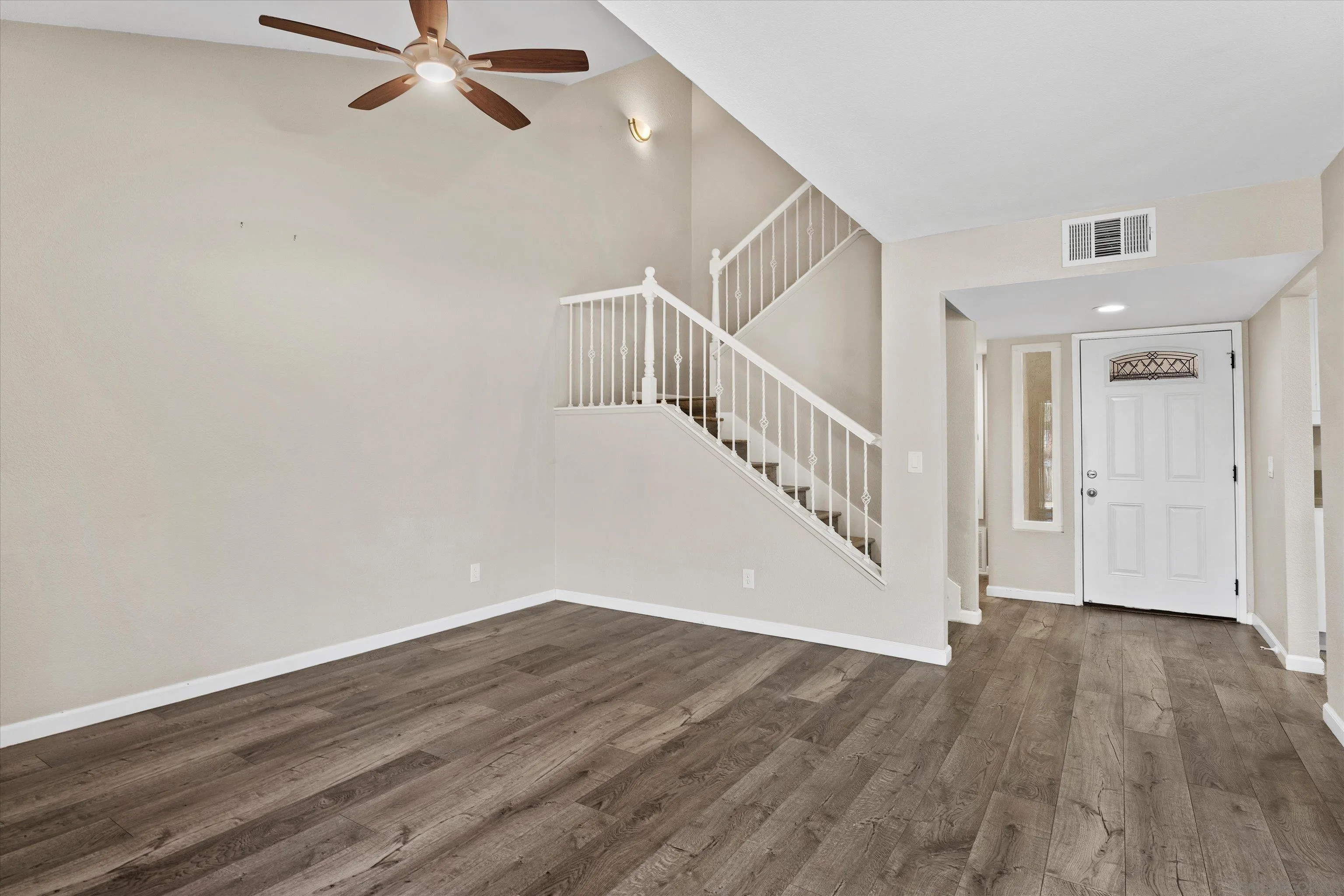 5636 Boot Way Oceanside, CA 92057 - Photo 3 of 36 a view of a room with wooden floor and white walls