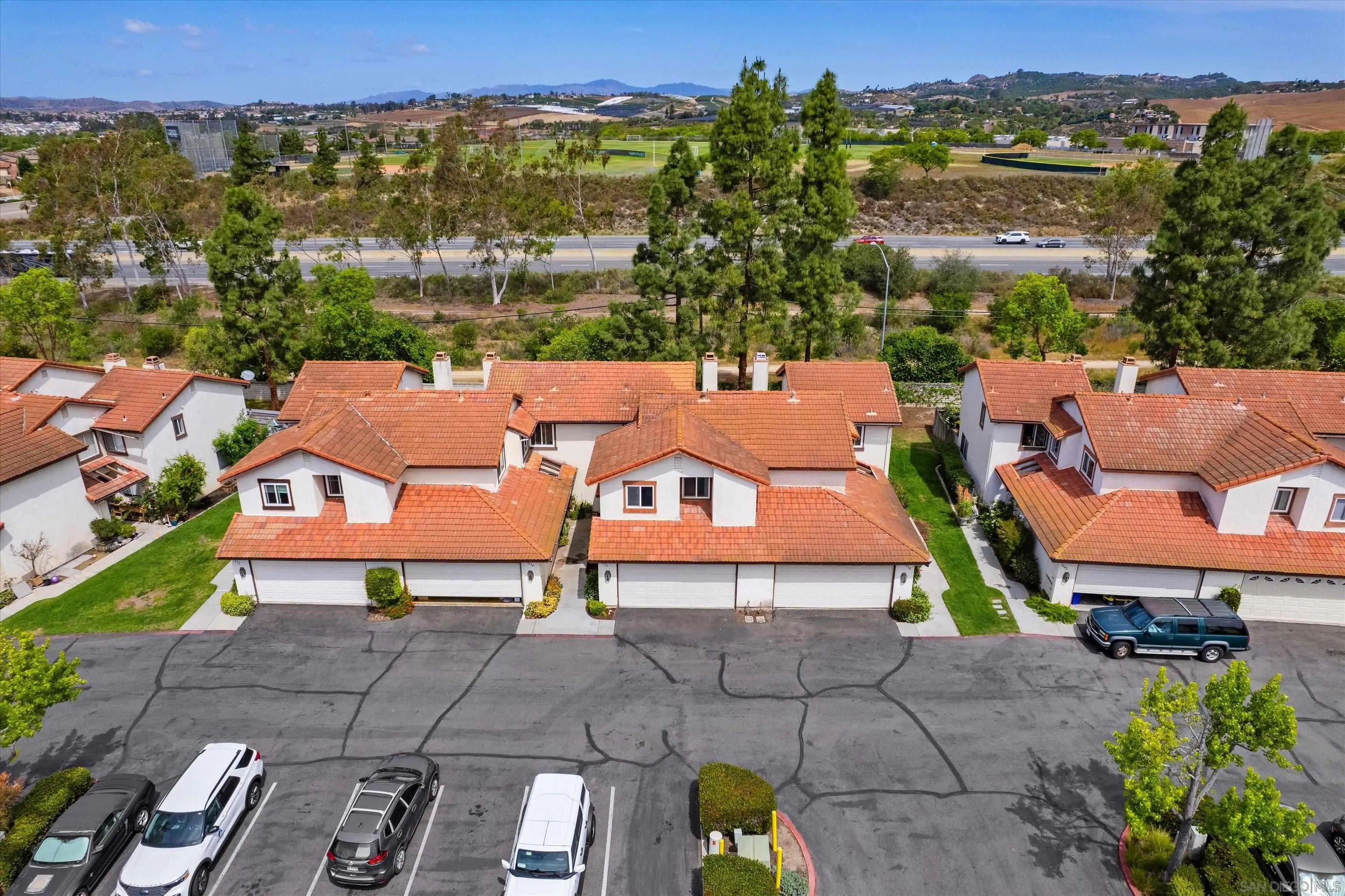 5636 Boot Way Oceanside, CA 92057 - Photo 32 of 36 an aerial view of multiple houses with a yard