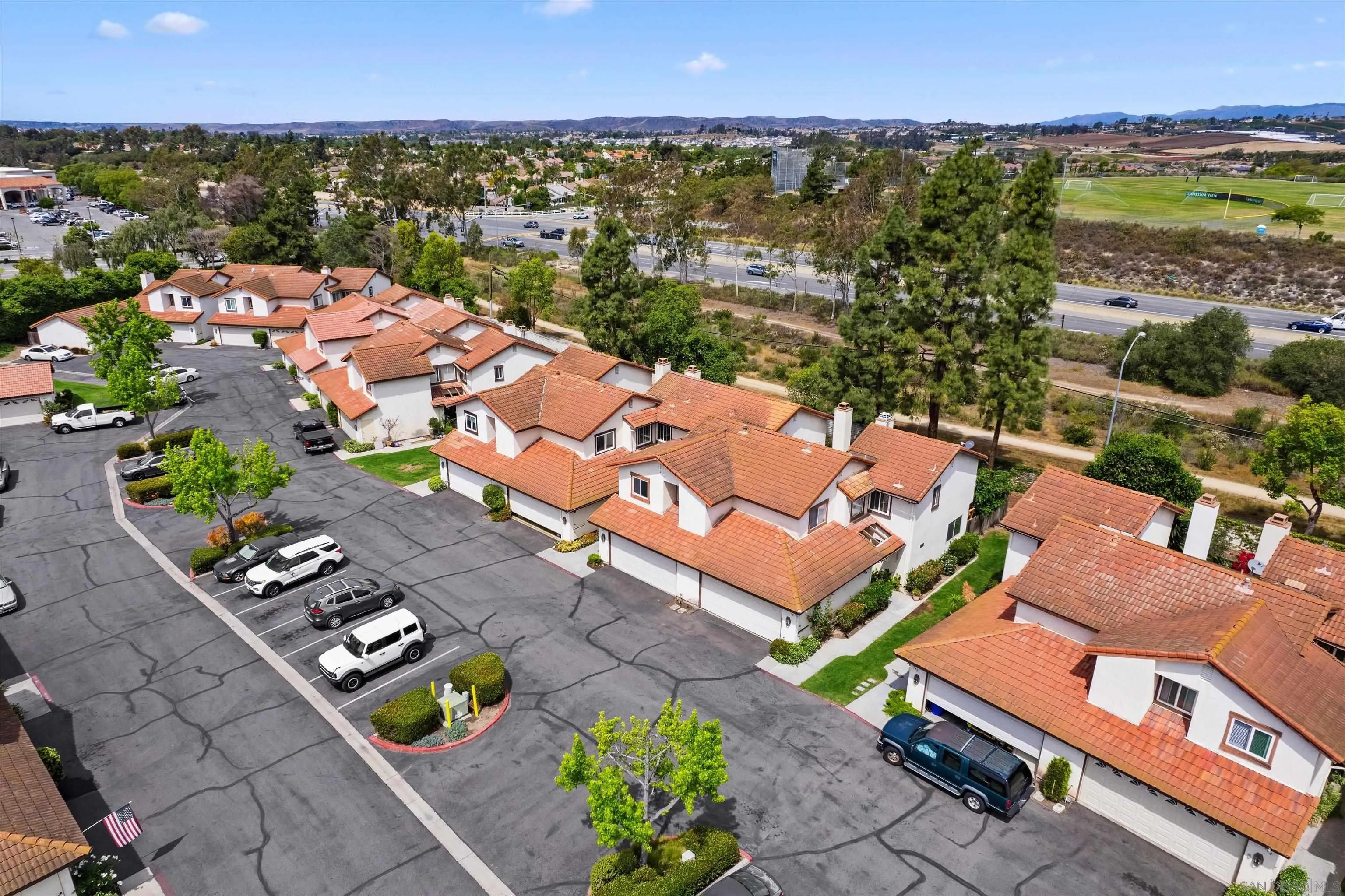 5636 Boot Way Oceanside, CA 92057 - Photo 34 of 36 an aerial view of a house with a garden and mountain view in back