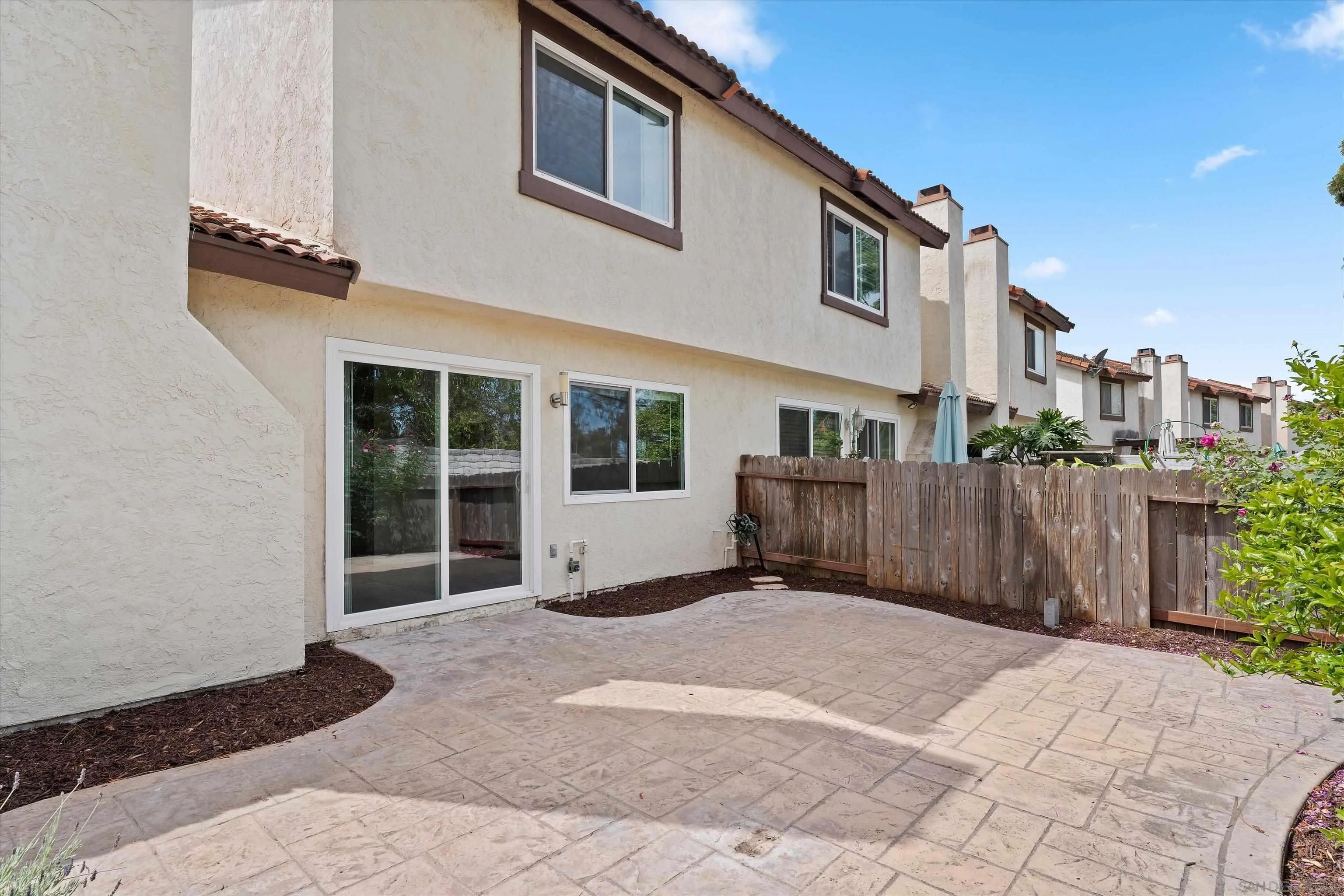 5636 Boot Way Oceanside, CA 92057 - Photo 7 of 36 a view of a house with a wooden fence