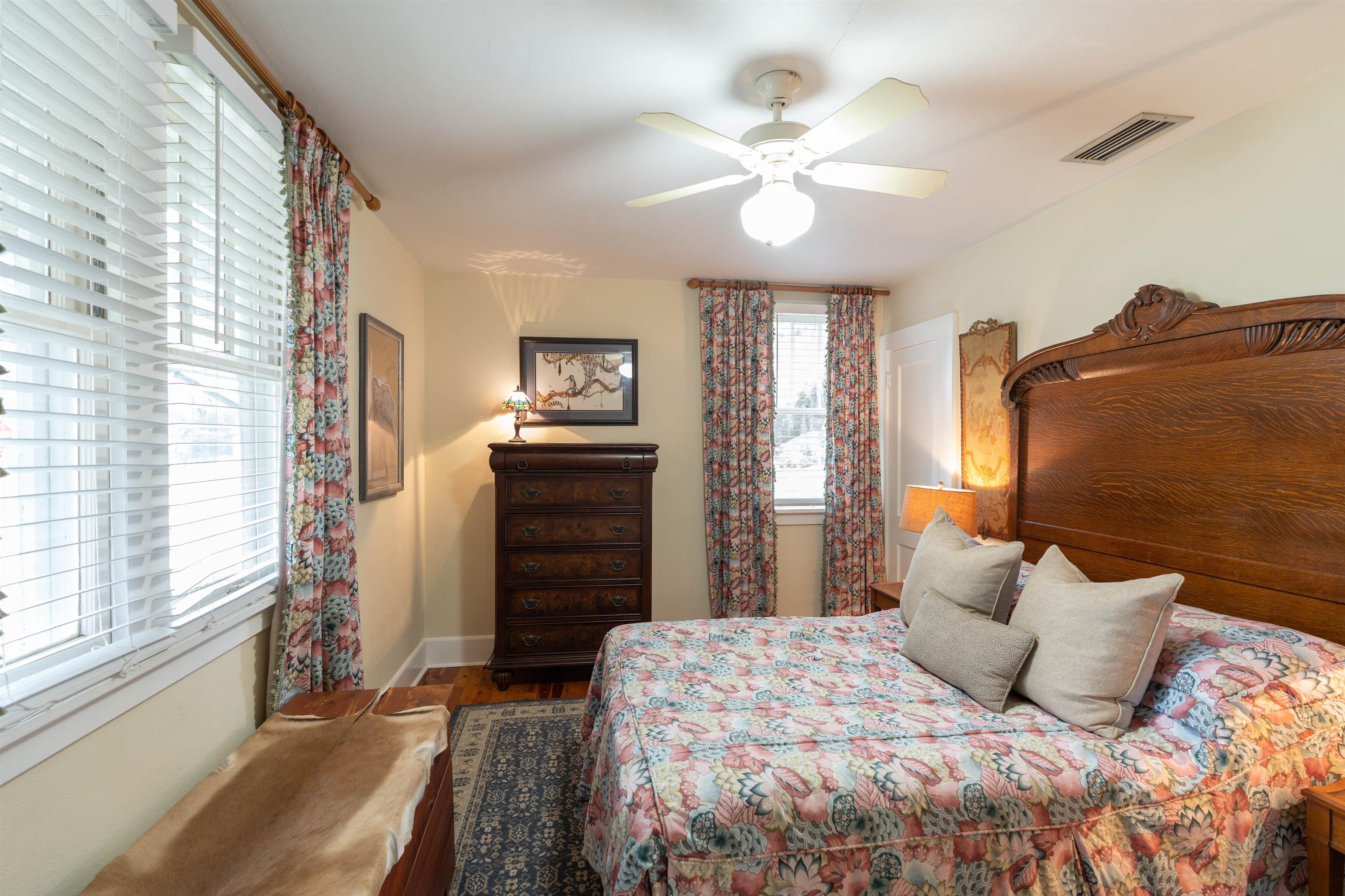 237 Rainey Avenue St. Augustine, FL 32084 - Photo 12 of 26 a bedroom with a bed and a chandelier
