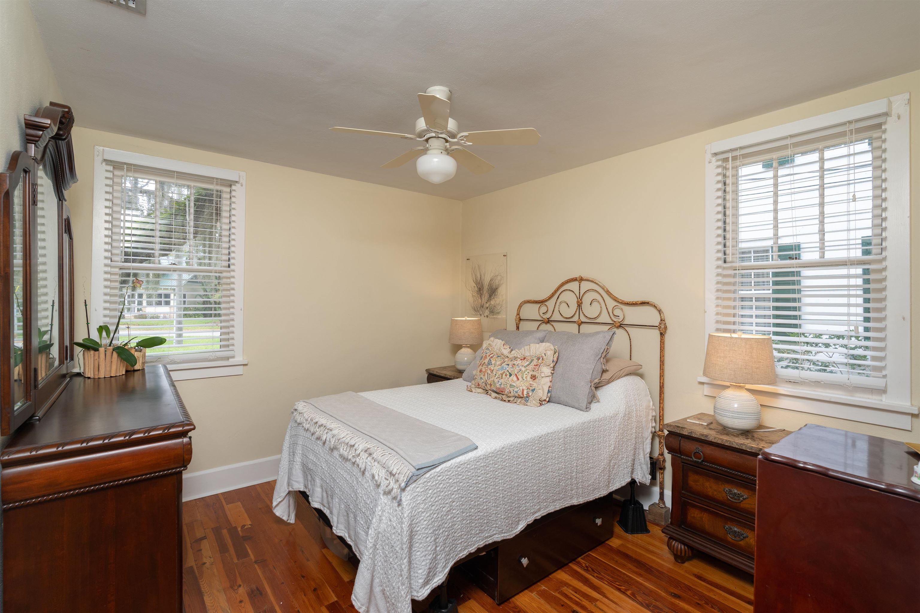 237 Rainey Avenue St. Augustine, FL 32084 - Photo 16 of 26 a bedroom with a bed and a chandelier