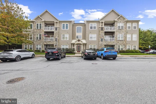 a view of multiple houses with a street