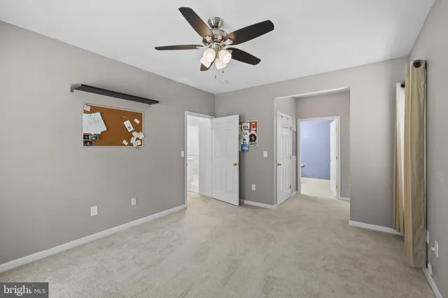 a view of a bathroom from a hallway