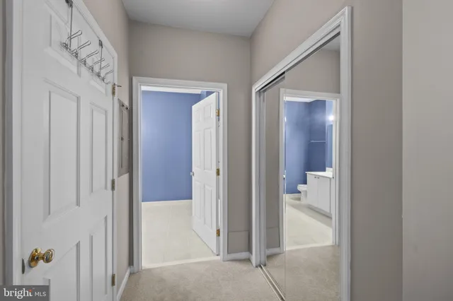 a bathroom with a shower and a glass door