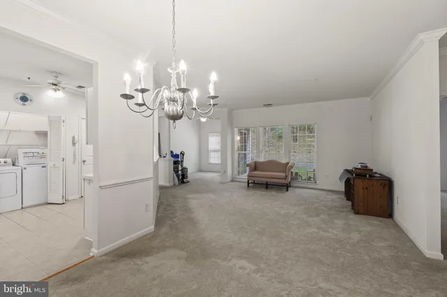 a living room with furniture and windows
