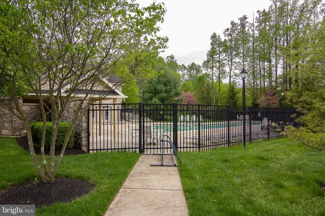 a view of a brick house with a yard