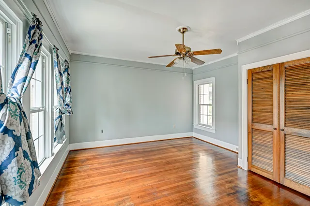wooden floor in an empty room with a window