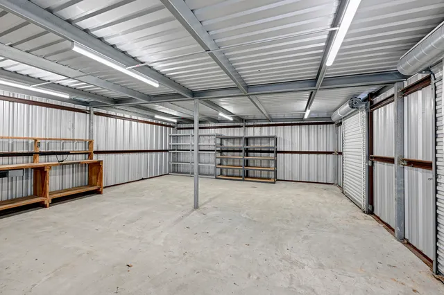 a view of an empty room with wooden walls