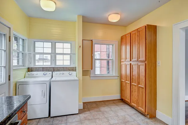 a view of a kitchen with large window