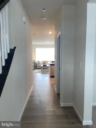 a view of a living room with a wooden floor