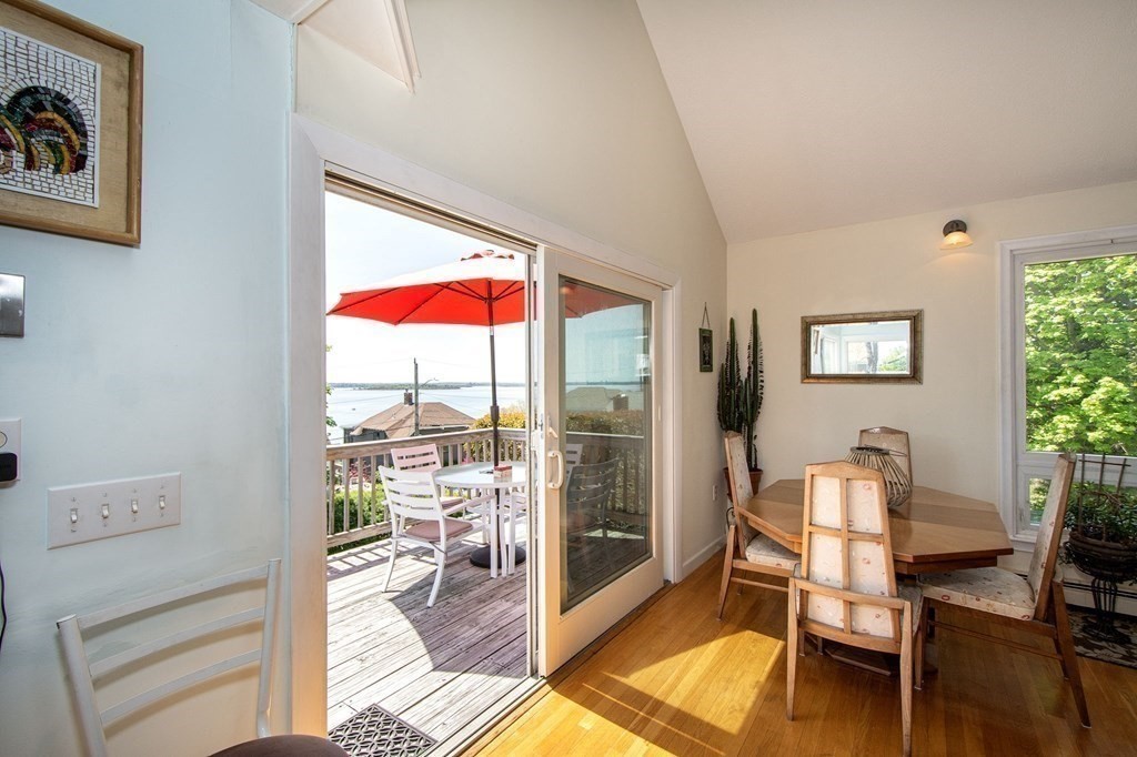 7 Bluff Road Hull, MA 02045 - Photo 11 of 35 a living room with furniture and a floor to ceiling window