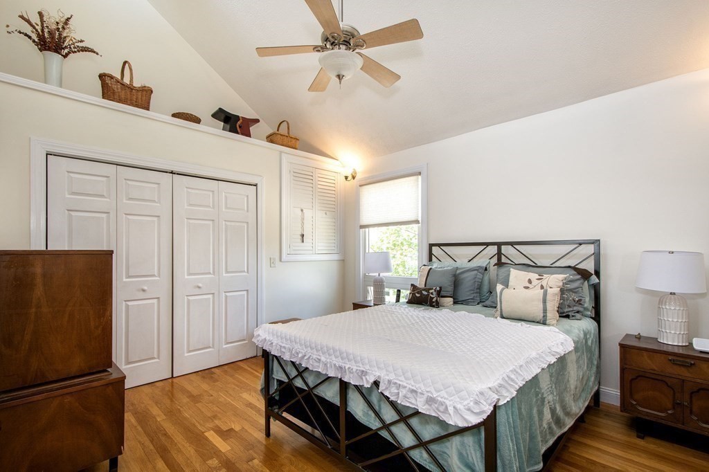 7 Bluff Road Hull, MA 02045 - Photo 18 of 35 a bedroom with a bed and a refrigerator