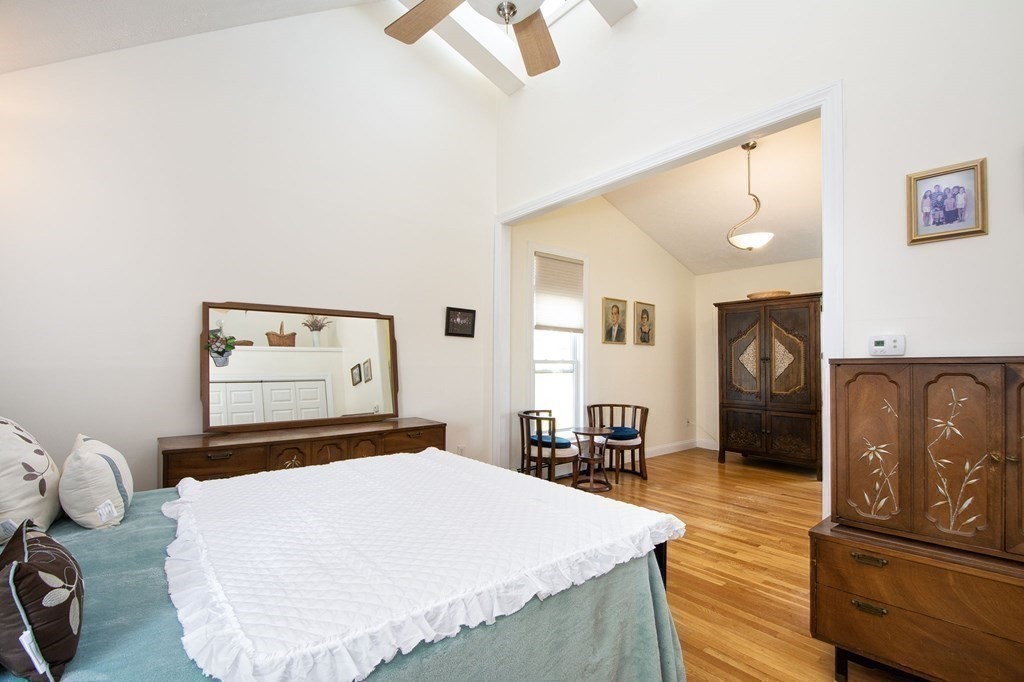 7 Bluff Road Hull, MA 02045 - Photo 19 of 35 a bedroom with a bed and a dresser