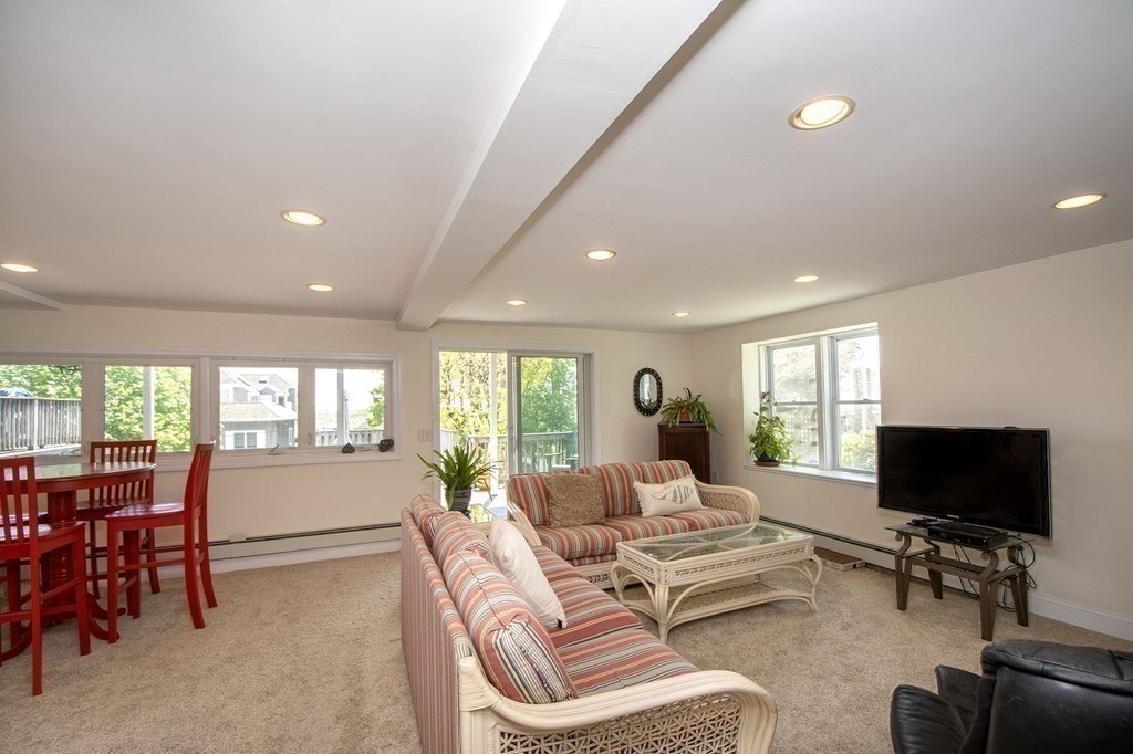 7 Bluff Road Hull, MA 02045 - Photo 28 of 35 a living room with furniture and a flat screen tv