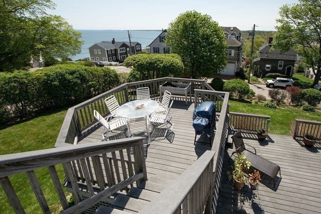 7 Bluff Road Hull, MA 02045 - Photo 30 of 35 a balcony with wooden floor table and chairs