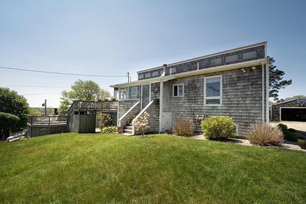 7 Bluff Road Hull, MA 02045 - Photo 3 of 35 a view of a house with a yard and a large tree