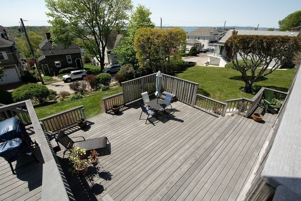 7 Bluff Road Hull, MA 02045 - Photo 31 of 35 a view of a roof deck with chair and potted plants