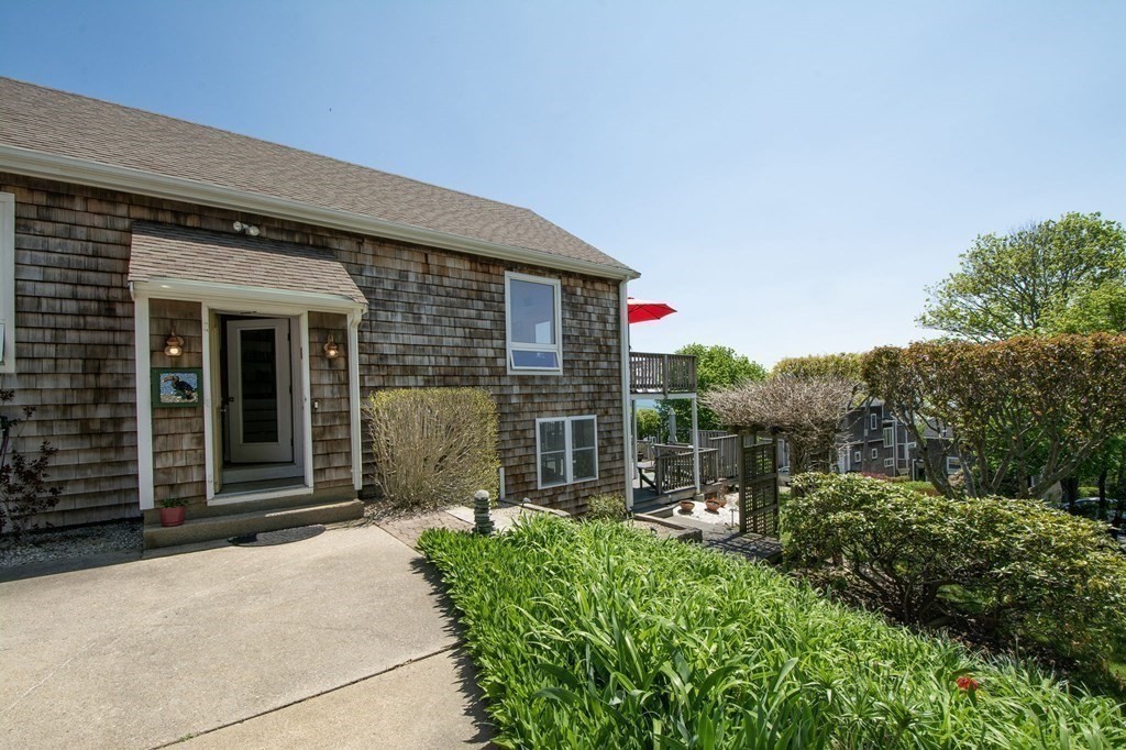 7 Bluff Road Hull, MA 02045 - Photo 4 of 35 a front view of a house with a garden