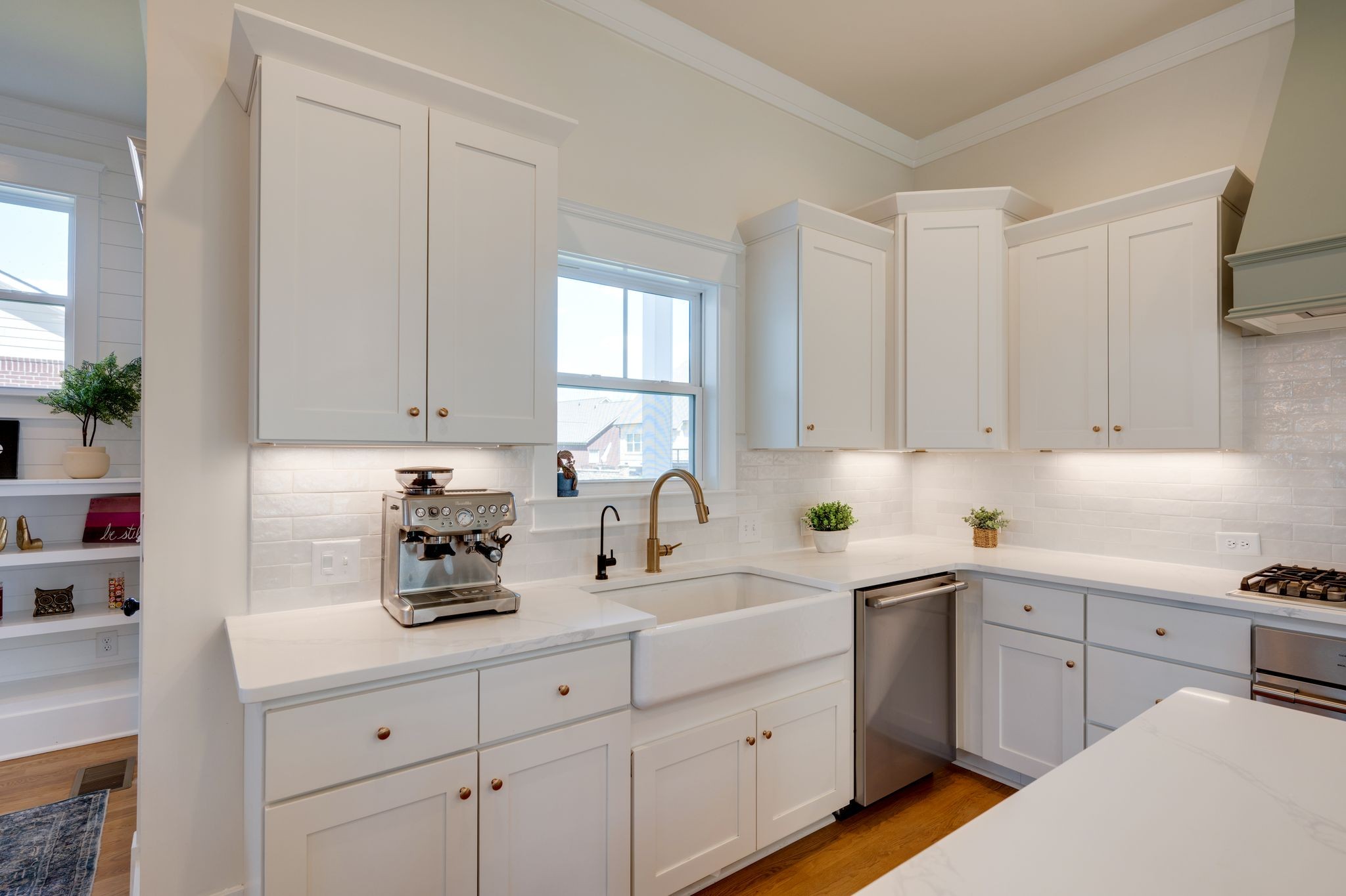 9011 Safehaven Place Spring Hill, TN 37174 - Photo 16 of 49 a kitchen with white cabinets and sink