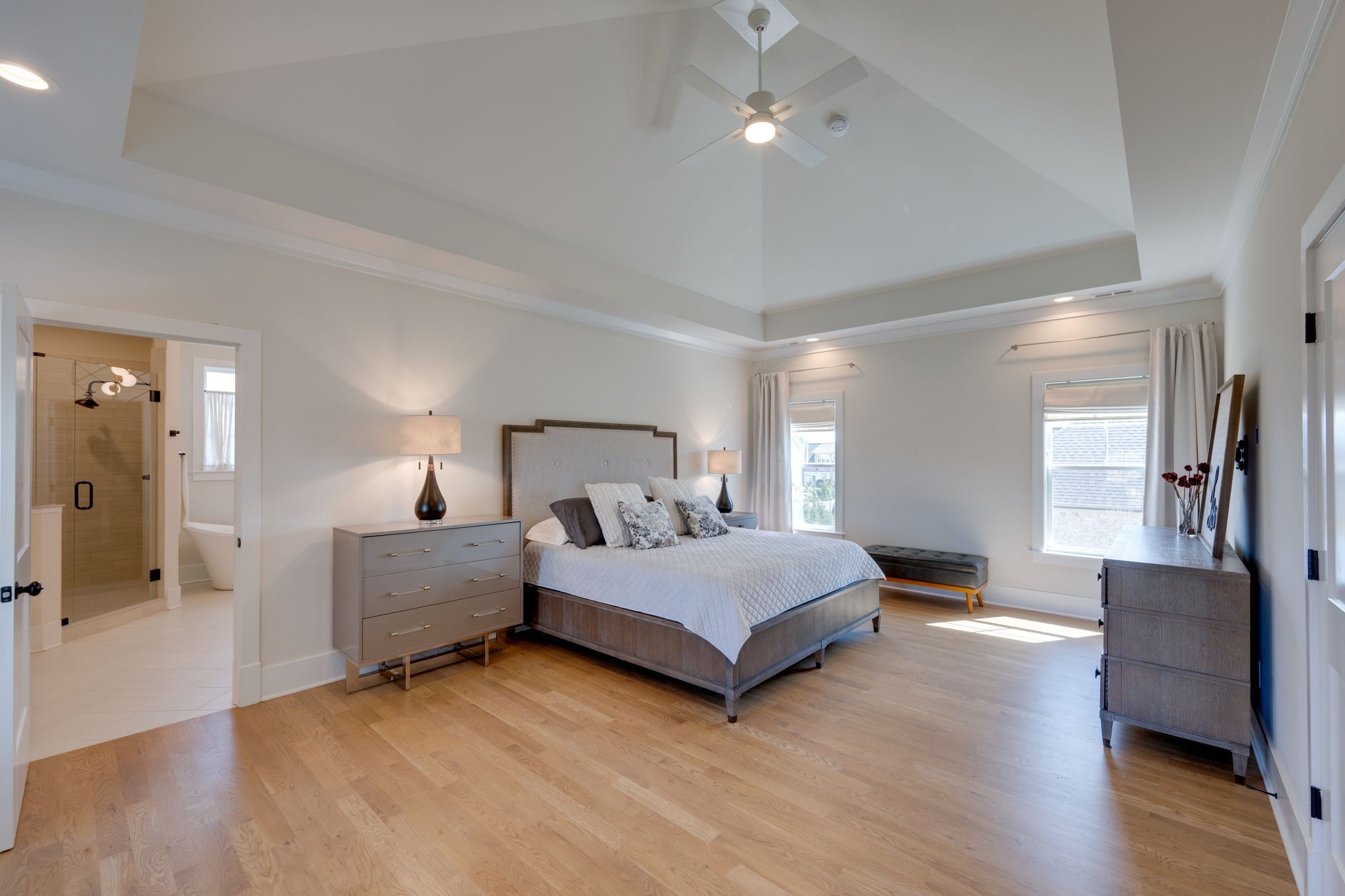 9011 Safehaven Place Spring Hill, TN 37174 - Photo 30 of 49 a spacious bedroom with a bed and wooden floor