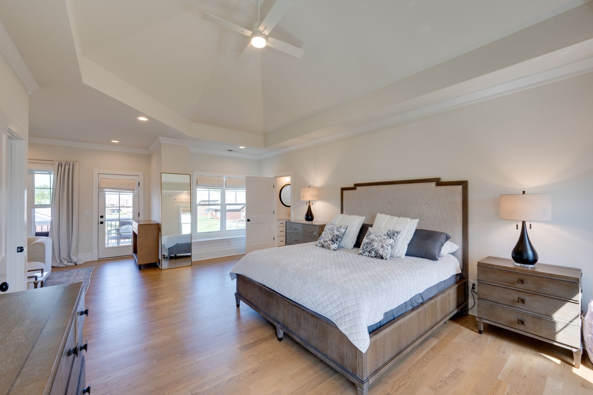 9011 Safehaven Place Spring Hill, TN 37174 - Photo 31 of 49 a bedroom with a large bed and wooden floor