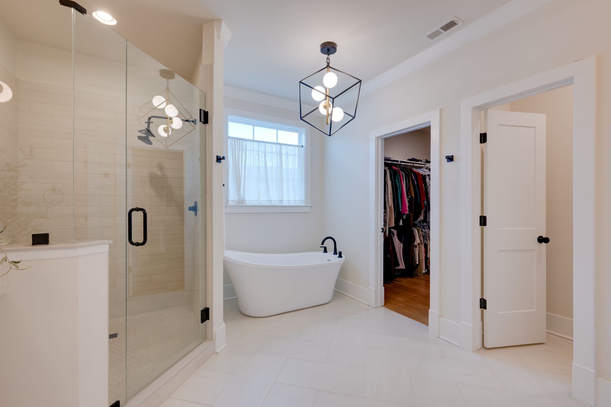 9011 Safehaven Place Spring Hill, TN 37174 - Photo 35 of 49 a spacious bathroom with a bathtub shower and a sink
