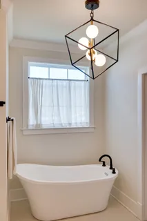 a white bath tub sitting in a bathroom