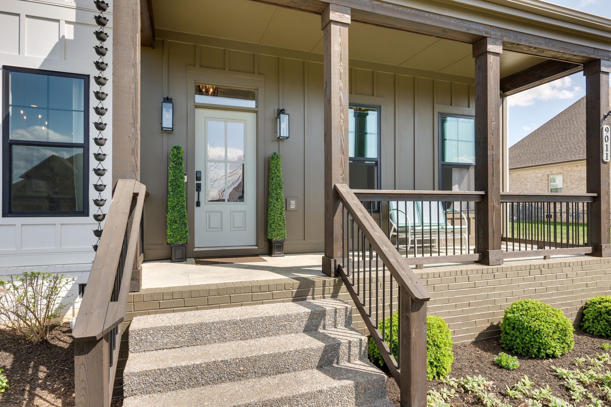 9011 Safehaven Place Spring Hill, TN 37174 - Photo 4 of 49 a view of staircase with railing and a potted plant