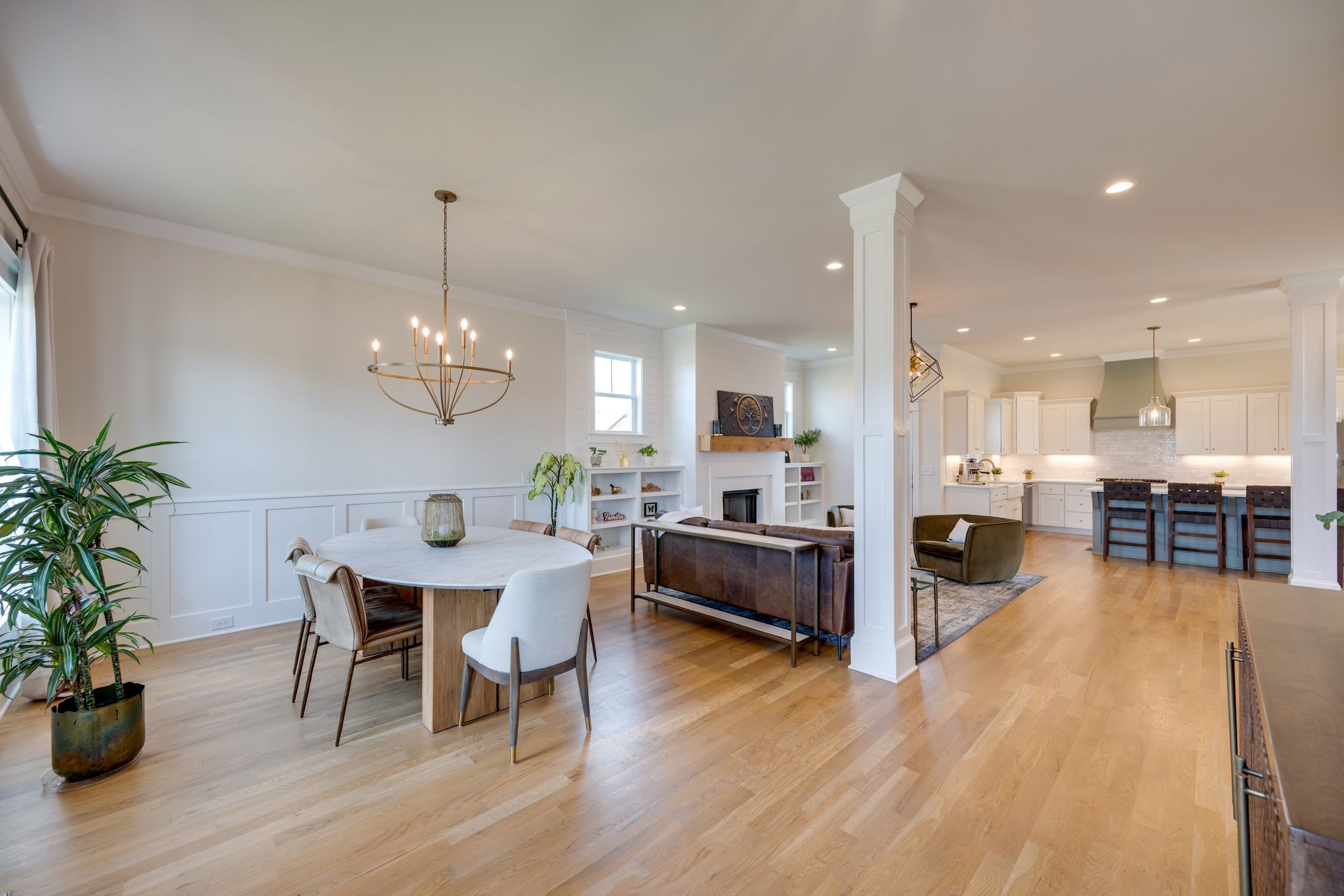9011 Safehaven Place Spring Hill, TN 37174 - Photo 5 of 49 a view of a dining room and livingroom with furniture wooden floor a chandelier