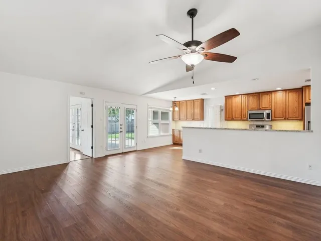 a view of a kitchen with a dishwasher cabinets and wooden floor
