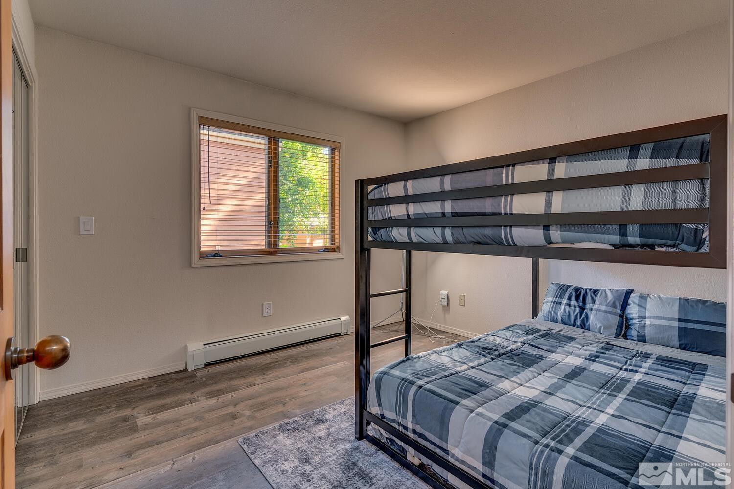 931 Incline Way, Unit 249 MCCLOUD Incline Village, NV 89451 - Photo 12 of 21 a bedroom with a bed and a window