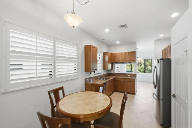 a stove top oven sitting inside of a kitchen