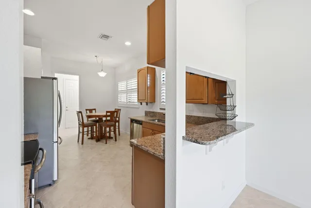 a view of a room with windows and chandelier