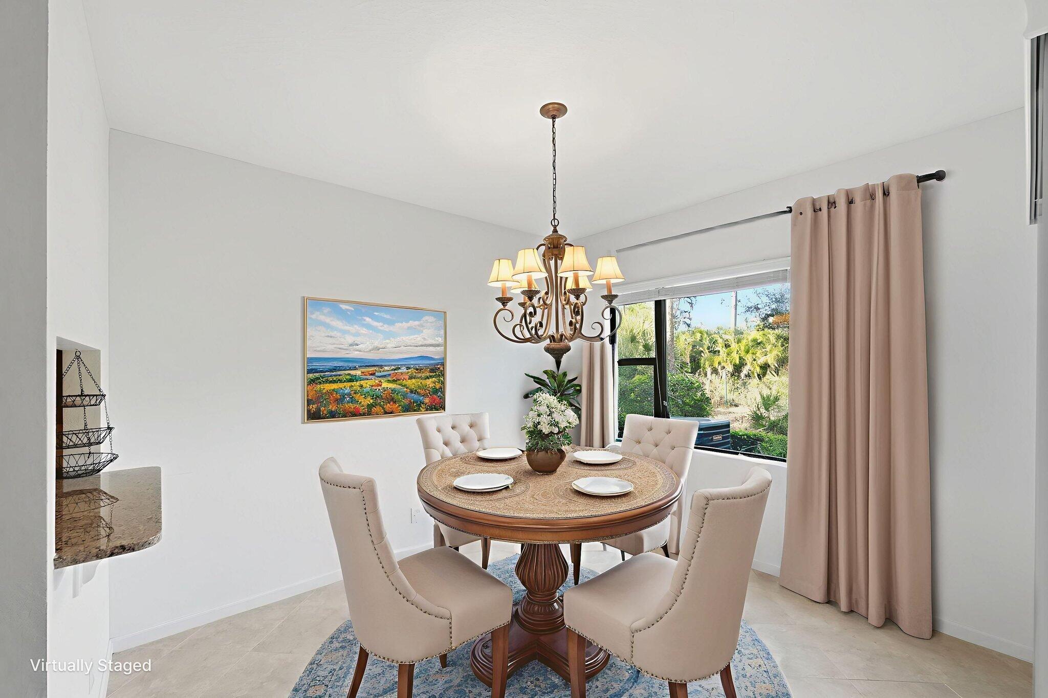 6675 Southeast Woodmill Pond Lane Stuart, FL 34997 - Photo 16 of 61 a view of a dining room with furniture window and outside view