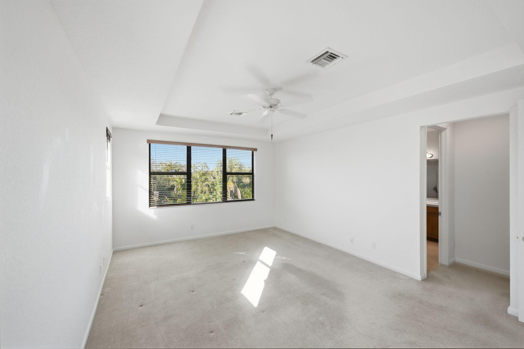 6675 Southeast Woodmill Pond Lane Stuart, FL 34997 - Photo 26 of 61 an empty room with windows and closet