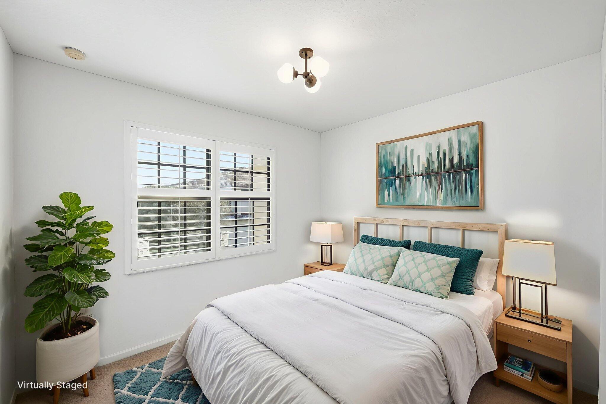 6675 Southeast Woodmill Pond Lane Stuart, FL 34997 - Photo 35 of 61 a bedroom with a bed and a window