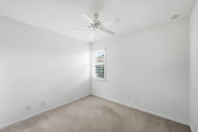 a view of a city with lots of residential buildings and mountain view in back