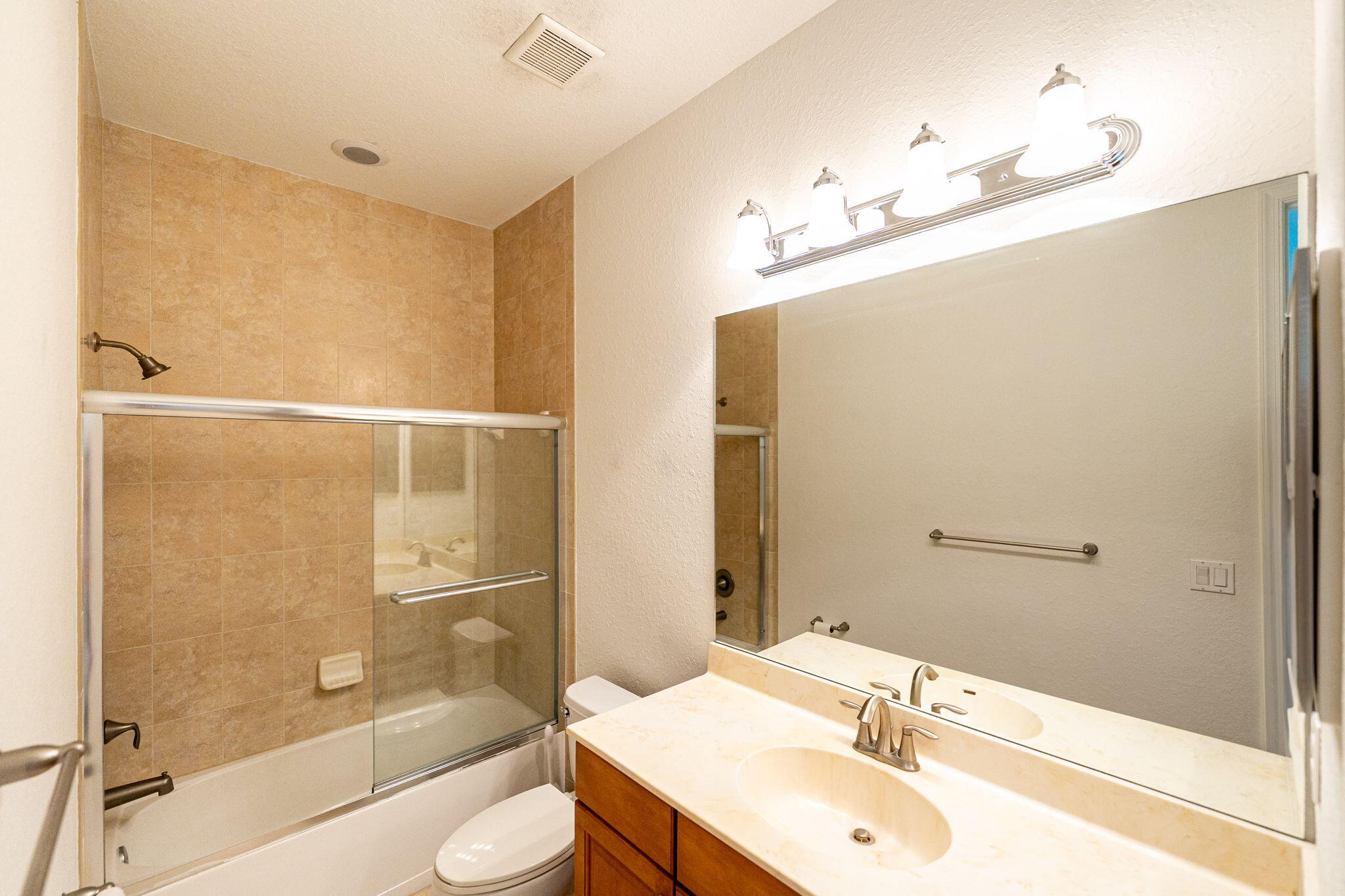 6675 Southeast Woodmill Pond Lane Stuart, FL 34997 - Photo 39 of 61 a bathroom with a sink and a mirror