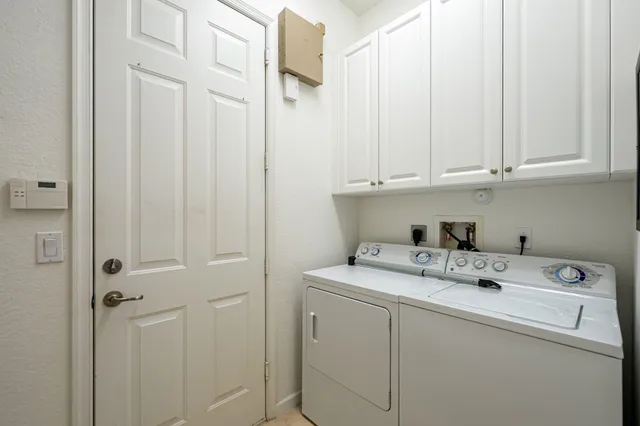 an aerial view of residential houses with outdoor space and river
