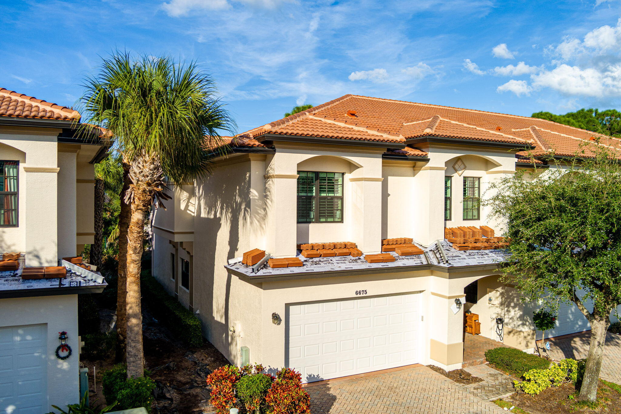 6675 Southeast Woodmill Pond Lane Stuart, FL 34997 - Photo 43 of 61 a front view of house with yard outdoor seating and barbeque oven