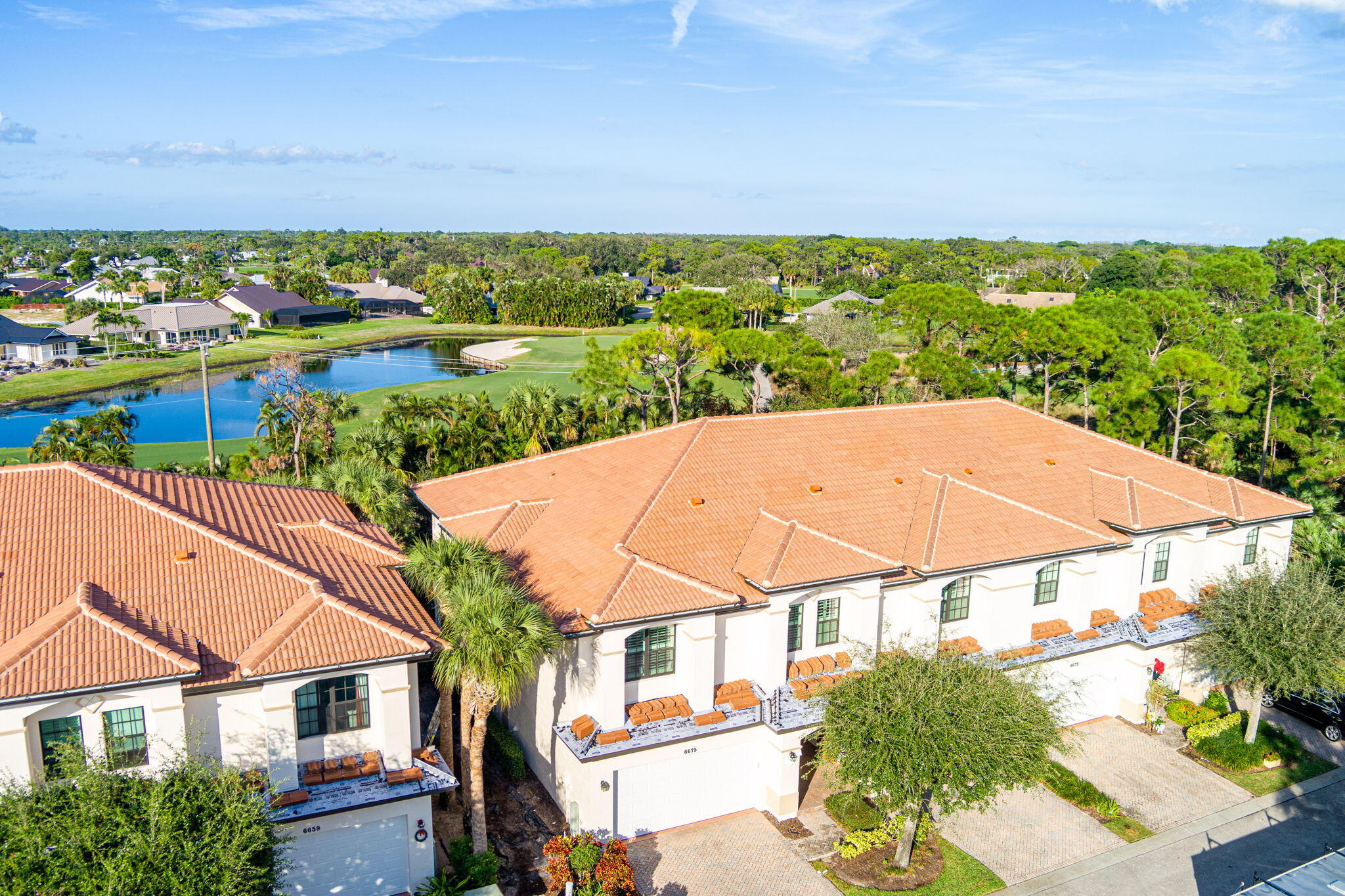 6675 Southeast Woodmill Pond Lane Stuart, FL 34997 - Photo 44 of 61 an aerial view of residential houses with outdoor space and trees