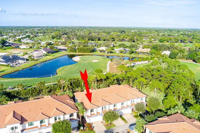 an aerial view of house with yard swimming pool and outdoor seating