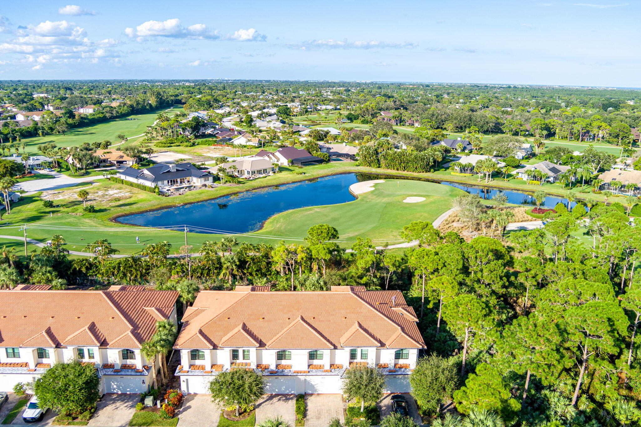 6675 Southeast Woodmill Pond Lane Stuart, FL 34997 - Photo 46 of 61 a view of a city with lots of residential buildings and mountain view in back